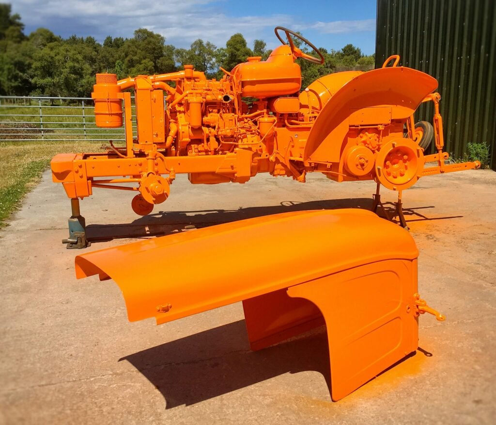 Tractor parts that have been sprayed orange